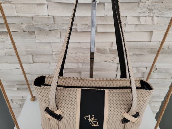 Sac à main " Popine " à l'épaule beige perforé et noir