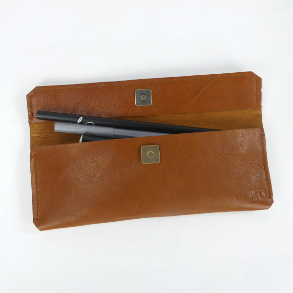 Trousse en cuir marron cognac